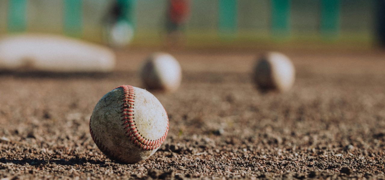 Baseballs on a field.