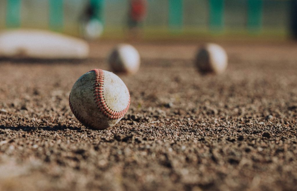 Baseballs on a field.